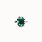 Ring with green oval faceted crystal
